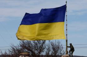 A Ukrainian flag flies at a naval base in Crimea in 2014 - source: Reuters