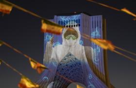 Photo showing the image of a masked nurse projected onto Iran's Azadi Monument.