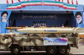 An Iranian Fateh-110 mobile missile launcher on parade
