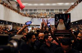 Supporters of Iraqi Shia cleric Moqtada al-Sadr gather during a sit-in, inside the parliament building in Baghdad - source: Reuters