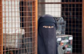 A woman at the Al-Hawl detention camp in Syria - source: Reuters