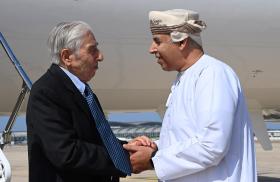 Baquer Namazi, a dual U.S.-Iranian citizen who had been imprisoned in Iran, shakes hands with an Omani official in Muscat - source: Reuters