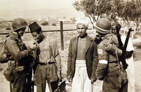 US Army soldiers meet local civilians in Morocco during Operation Torch in November 1942 - source: U.S. Army