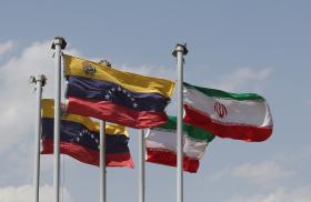 Venezuelan and Iranian flags flying during a state visit in Tehran - source: Reuters