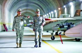 Iranian military officers, including Major General Bagheri, tour an underground air base - source: Iranian government