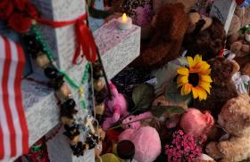 A memorial to victims of the mass shooting at the Allen Premium Outlet mall near Dallas, Texas - source: Reuters