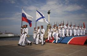 Russian sailors parade with their national and Navy flags in the port of Sevastopol in occupied Crimea - source: Reuters