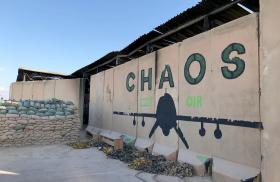 Photo of a blast wall with a drone mural at al-Asad Air Base in Iraq.