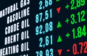 A video board displays various oil and gas commodity prices in September 2023 - source: Reuters