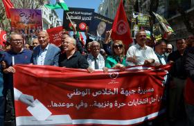 Imed Khemiri, a senior official in the Ennahda party and member of the Salvation Front (L) takes part in a protest, demanding the release of imprisoned journalists, activists, opposition figures and setting a date for fair presidential elections in Tunis, Tunisia May 12, 2024 - source: Reuters