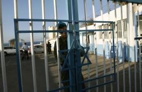 An Israeli border guard secures the gate at a crossing with Lebanon in 2007 - source: Reuters