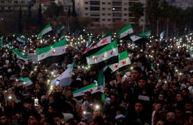 Syrian civilians celebrate the fall of the Assad regime in downtown Damascus in December 2024 - source: Reuters