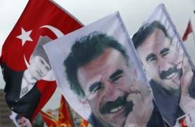 Demonstrators fly a mixture of Turkish flages featuring the image of the Republic of Turkey's founder, Kemal Mustafa Ataturk, and banners depicting Kurdish militia leader Abdullah Ocalan - source: Reuters