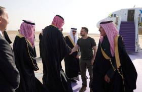 Photo showing Ukraine's President Zelensky greeting Saudi officials on the tarmac. 