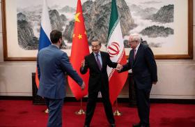 Chinese Foreign Minister Wang Yi greets Russian Deputy Foreign Minister Sergey Ryabkov and Iranian Deputy Foreign Minister Kazem Gharibabadi in Beijing in March 2025 - source: Reuters