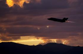 An F35A fighter on a night-training mission at dusk