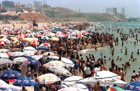 Sunbathers gather on Al-Baida beach in Lebanon - source: Reuters