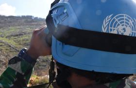 A United Nations peacepeeker scans the terrain in southern Lebanon - source: Untied Nations