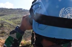 A United Nations peacepeeker scans the terrain in southern Lebanon - source: Untied Nations