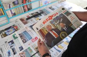 A man holds a newspaper featuring a photograph of U.S. President Trump and his Middle East advisor, Steve Witkoff, in Tehran - source: Reuters