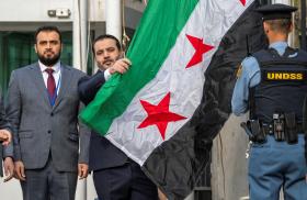 Syrian Foreign Minister Asaad Hassan al-Shibani attends the ceremony of the new Syrian government flag being raised for the first time, outside United Nations Headquarters in New York, U.S., April 25, 2025 - source: Reuters