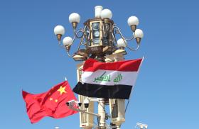 Chinese and Iraqi flags fly in Beijing during a state visit - source: Reuters