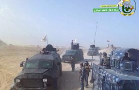 Harakat al-Abdal armored vehicles and flags