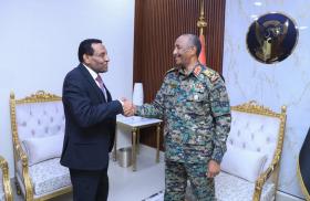 Burhan and Idris shake hands
