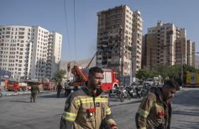 Emergency crews work at the scene of an Israeli air strike in Tehran in June 2025 - source: Reuters