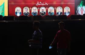 A sign in Tehran displays images of officials in Iran's nuclear program killed in Israeli airstrikes in June 2025 - source: Reuters