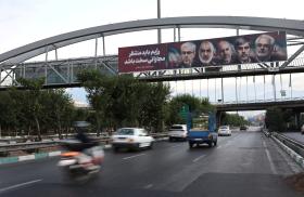 A highway bridge in Tehran displays images of nuclear scientists killed during Israeli strikes against Iran in June 2025 - source: Reuters