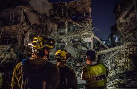 Israeli firefighters work at the site of in Iranian missile strike on a residential building in Tel Aviv in June 2025 - source: Reuters
