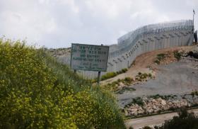 A sign and barrier along the Israel-Lebanon border - source: Reuters