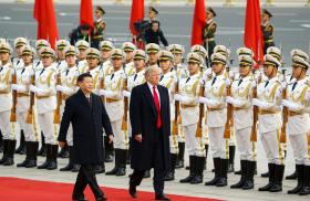 Chinese president Xi walks with U.S. president Trump in Beijing in 2017 - source: Reuters