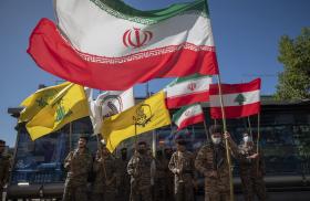 Flags of Iran, Hezbollah, and Lebanon are seen at a Quds Day celebration in Tehran - source: Reuters