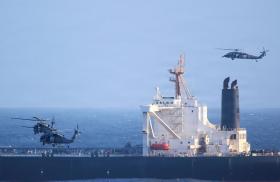 U.S. military helicopters interdict an oil tanker on suspicion of aiding the Iranian regime.