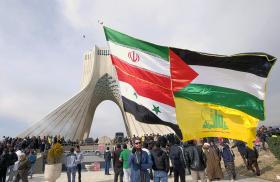 Protesters display Iranian, Syrian, Palestinian, and Hezbollah flags - source: Reuters
