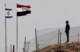 Egyptian and Israeli flags along the Sinai border