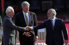 Isaeli Prime Minister Yitzhak Rabin shakes hands with Jordanian King Hussein in front of U.S. President Bill Clinton at the White House in 1994.