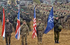 NATO solderis with alliance and national flags